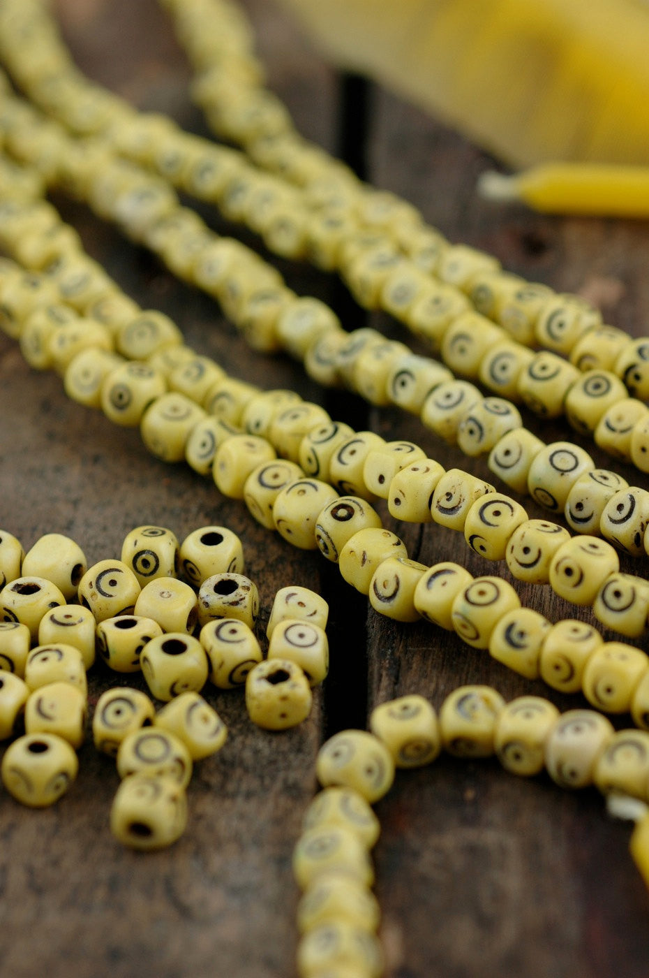 Yellow Tumbling Dice: Hand Carved Bone Beads, 5x5mm, 48 pieces - ShopWomanShopsWorld.com. Bone Beads, Tassels, Pom Poms, African Beads.