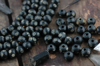 Dot in Circle: Black, White Bone Beads, 8x10mm, 24 pieces - ShopWomanShopsWorld.com. Bone Beads, Tassels, Pom Poms, African Beads.