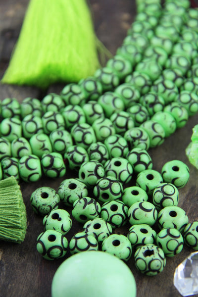 Lime Loops: Green Hand Carved Bone Beads, 8x11mm, 22 pieces - ShopWomanShopsWorld.com. Bone Beads, Tassels, Pom Poms, African Beads.