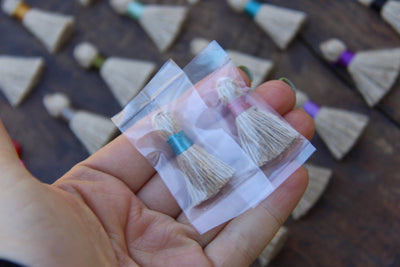 Mini Jute Tassels, 1.25" with Colored Binding, 10+ pieces - ShopWomanShopsWorld.com. Bone Beads, Tassels, Pom Poms, African Beads.