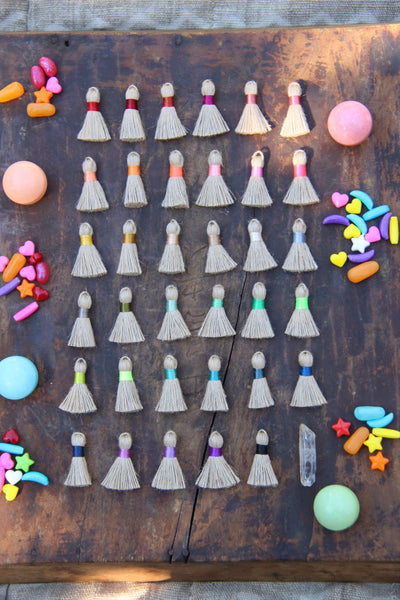 Mini Jute Tassels, 1.25" with Colored Binding, 10+ pieces - ShopWomanShopsWorld.com. Bone Beads, Tassels, Pom Poms, African Beads.