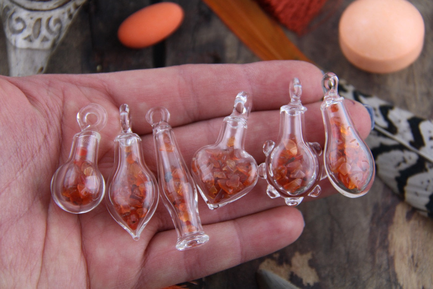Carnelian Magic: Tiny Glass Bottle Pendant with Carnelian Chips, Charm with Gemstone Chips, Bohemian Jewelry Making Supply, Gift for Her - ShopWomanShopsWorld.com. Bone Beads, Tassels, Pom Poms, African Beads.