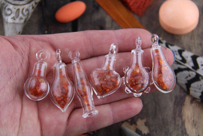 Carnelian Magic: Tiny Glass Bottle Pendant with Carnelian Chips, Charm with Gemstone Chips, Bohemian Jewelry Making Supply, Gift for Her - ShopWomanShopsWorld.com. Bone Beads, Tassels, Pom Poms, African Beads.