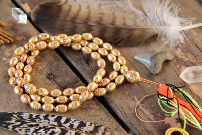 Ethiopian Brass and Copper Hollow Bead Mala, 9x12mm, Authentic Handmade African Tribal Jewelry Mala Making, Craft Supplies, Golden Beads - ShopWomanShopsWorld.com. Bone Beads, Tassels, Pom Poms, African Beads.